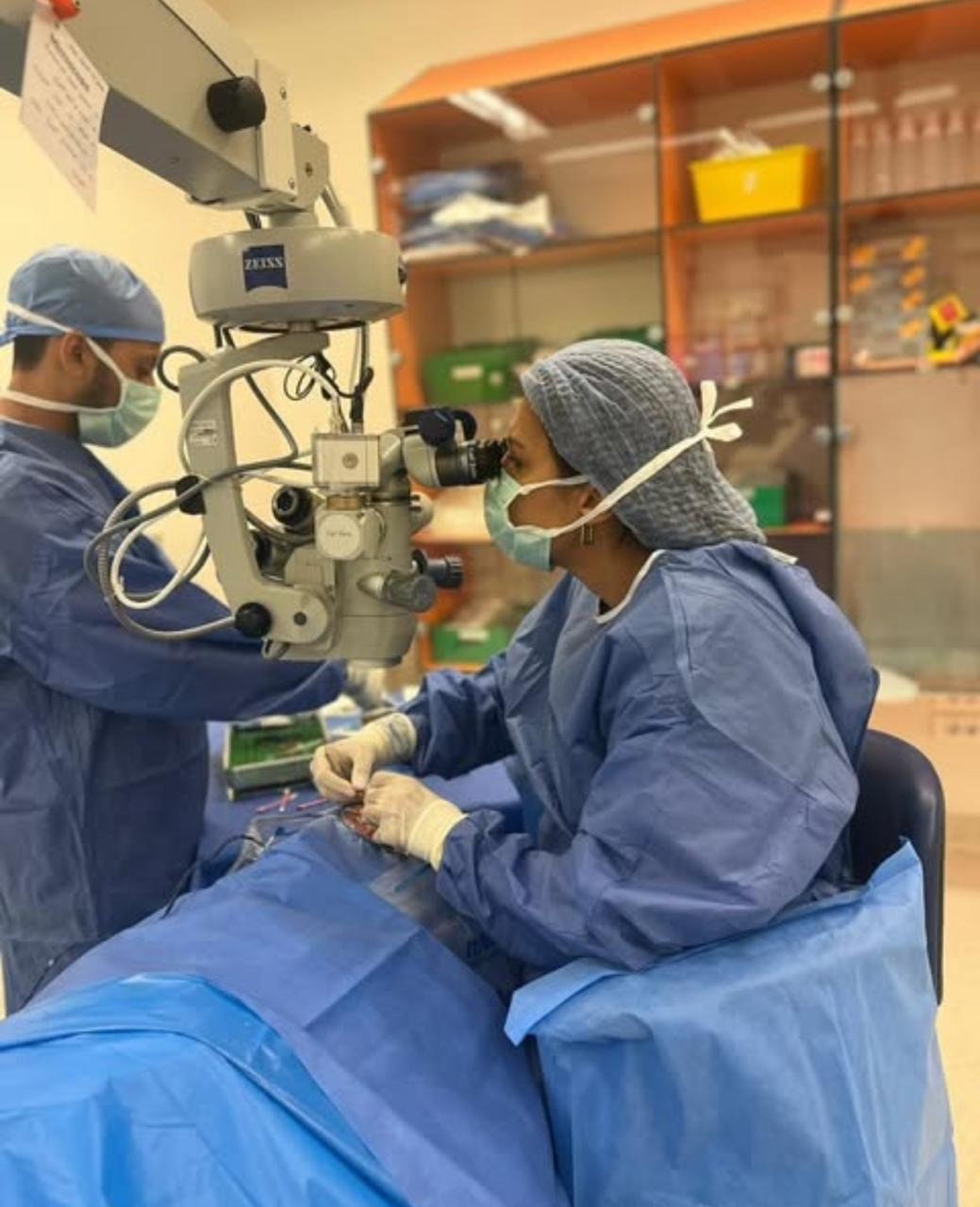 Prof. Dr. Yomna Magdy performing glaucoma surgery using an operating microscope at Watany Eye Hospital